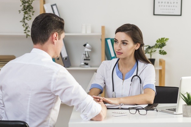 back-view-patient-talking-with-female-doctor_23-2148396680